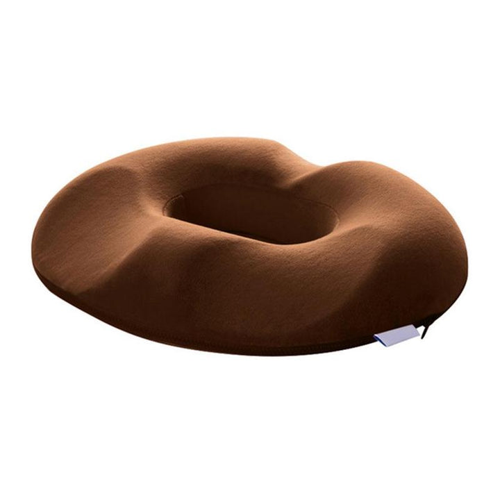 Ergonomic donut seat cushion placed on a modern office chair for daily use