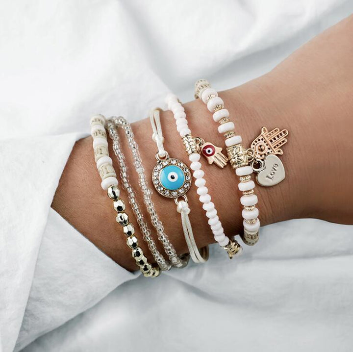 Women's stacked evil eye bracelet set worn on wrist