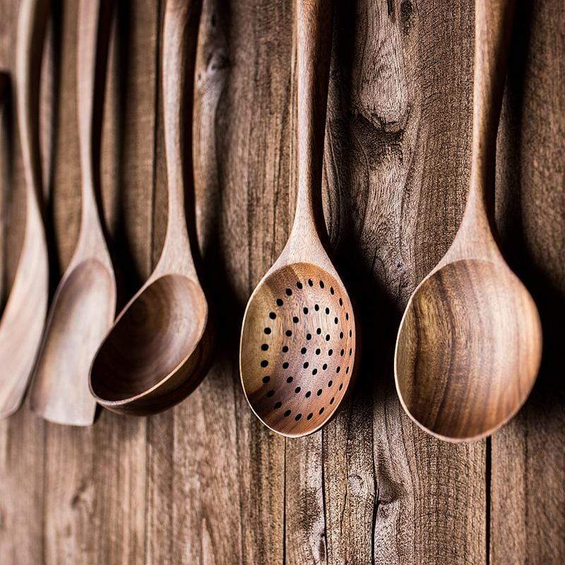 Eco-friendly wooden kitchen utensil set displayed for daily cooking use