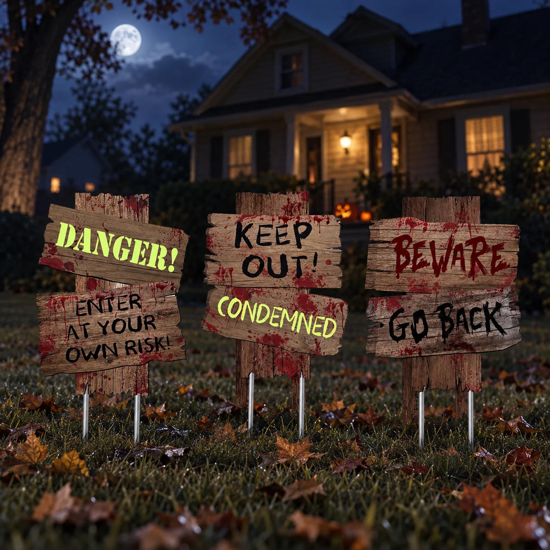 Halloween Dreadwood garden warning signs displayed on a spooky lawn at night