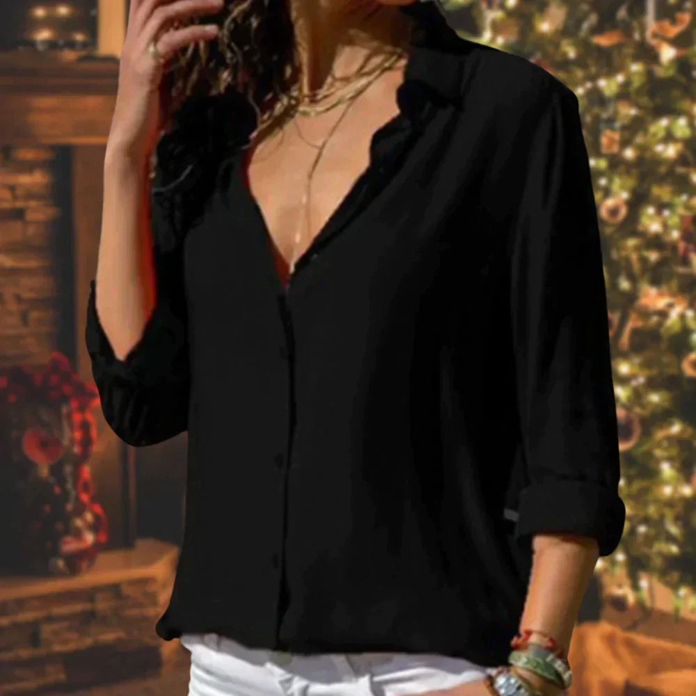 Back view of classic button-up blouse featuring relaxed fit and smooth fabric