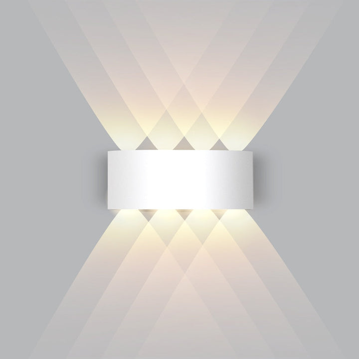 White modern LED wall lamp casting a dual light beam upward and downward on a neutral wall