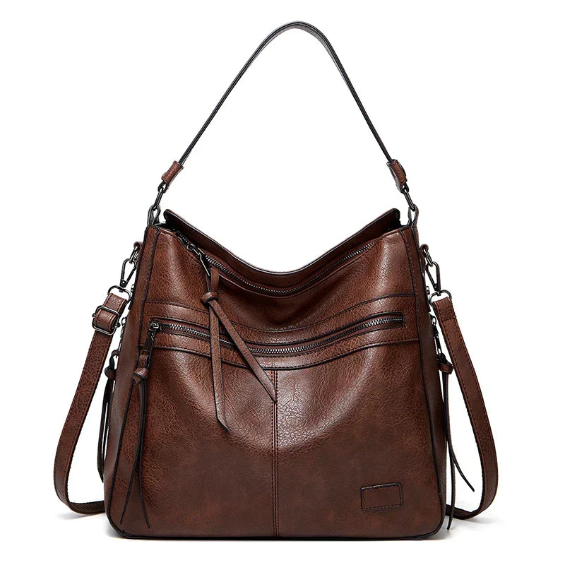 Detailed view of the premium brown handbag showing structured design and stitching