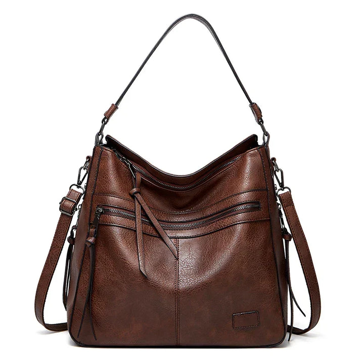 Detailed view of the premium brown handbag showing structured design and stitching