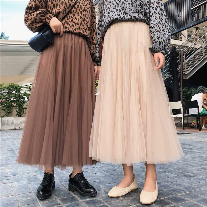Close-up of pleated fabric texture on womens long maxi skirt