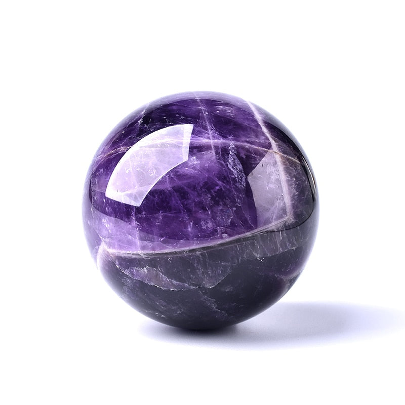 Handcrafted purple crystal globe serving as a unique polished mineral desk ornament.