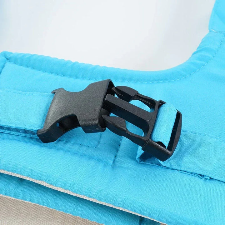 Close-up of the durable plastic buckle on the adjustable baby safety strap