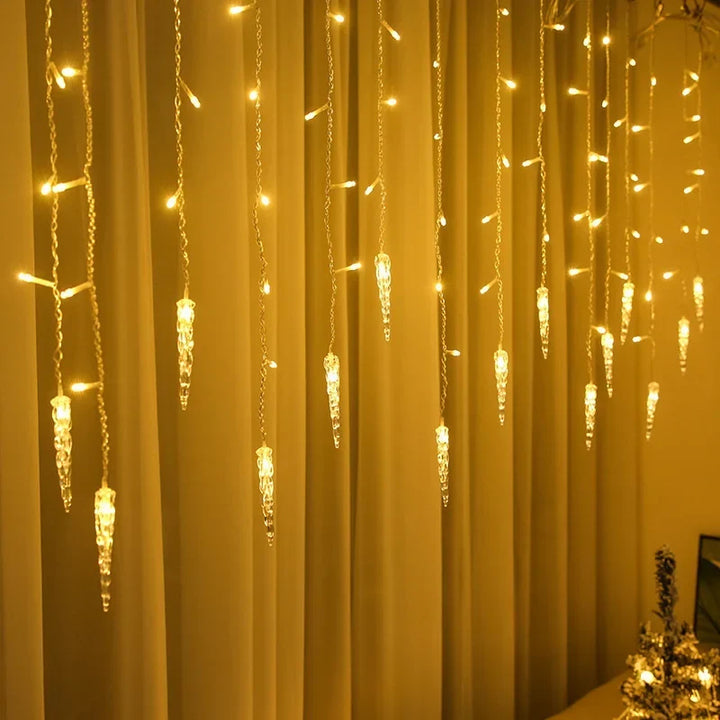 Warm white cascading icicle lights hanging against an indoor backdrop