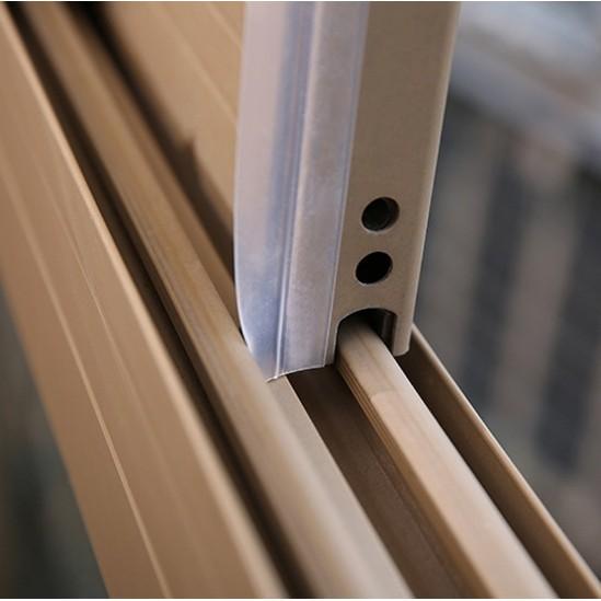 Brown window track sealed neatly with a flexible draught stripping roll