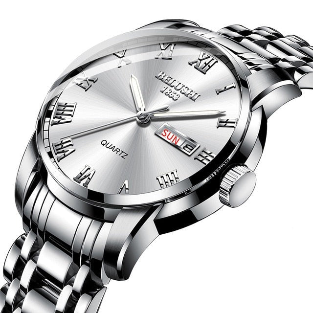 Mens luminous watch showing glowing hands in dark lighting conditions