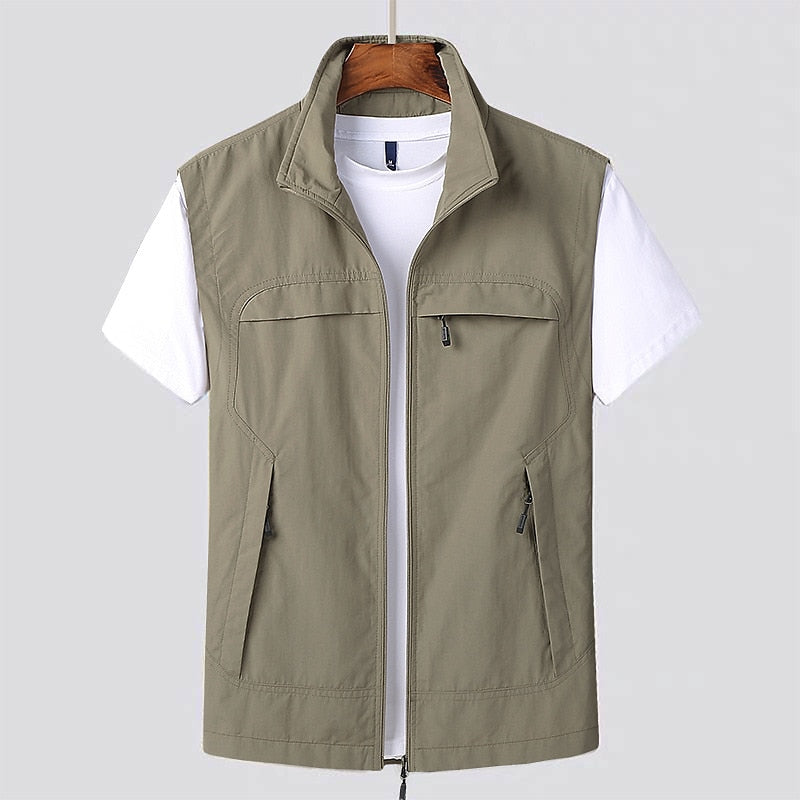 Mens water-repellent utility vest in olive green with multiple pockets for outdoor layering