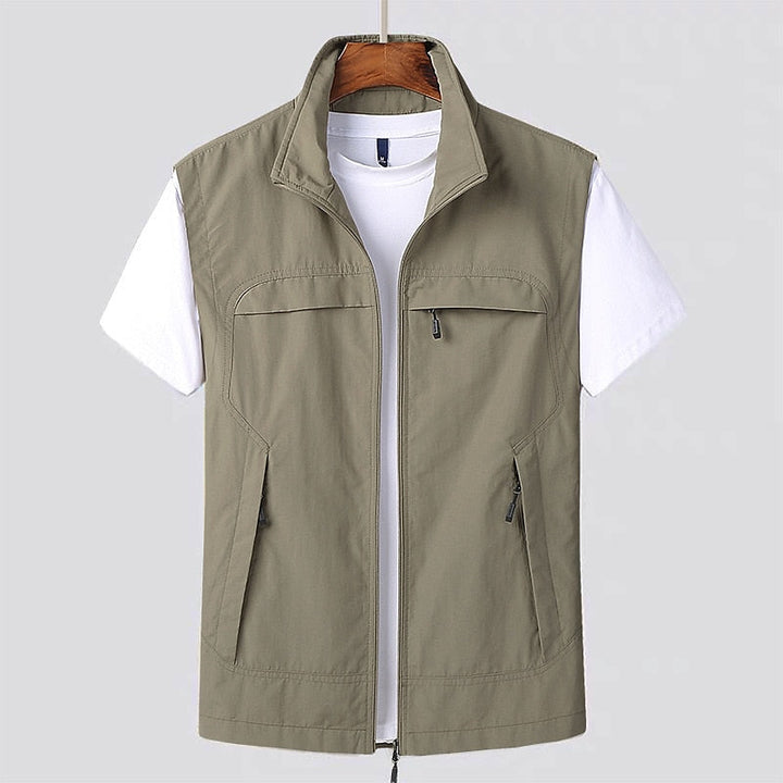 Mens water-repellent utility vest in olive green with multiple pockets for outdoor layering
