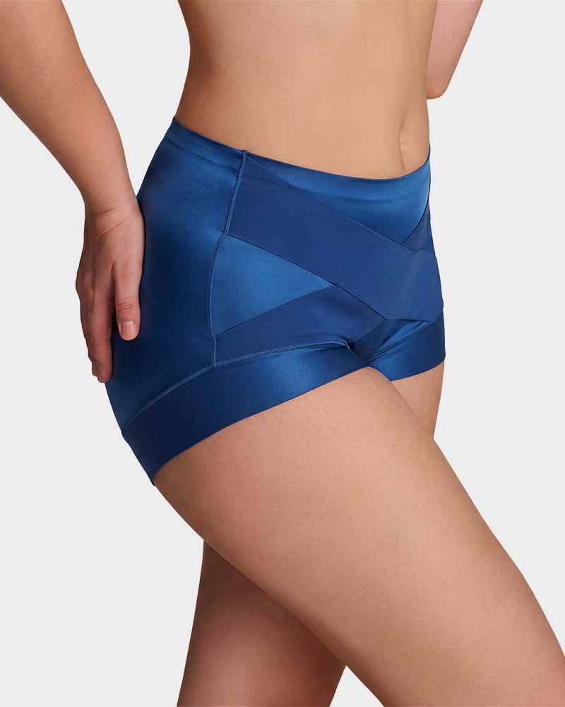Detailed shot of the cross compression band on tummy control shapewear