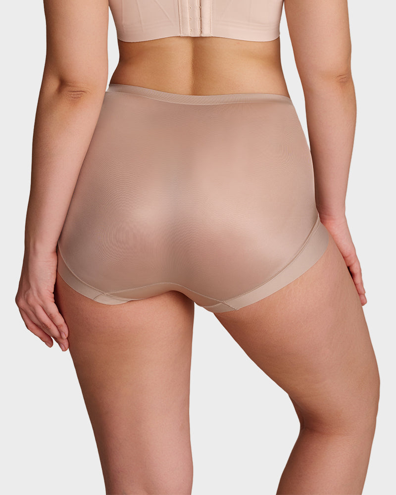 Close-up of breathable fabric on high-waist cross compression shaping briefs