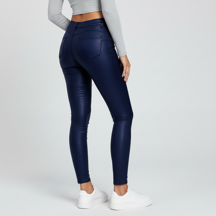Close-up fabric detail of blue high-waisted stretch skinny trousers