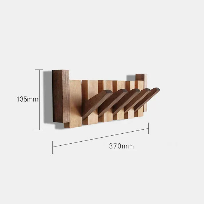 Angle shot of wooden wall-mounted coat rack displaying sleek design