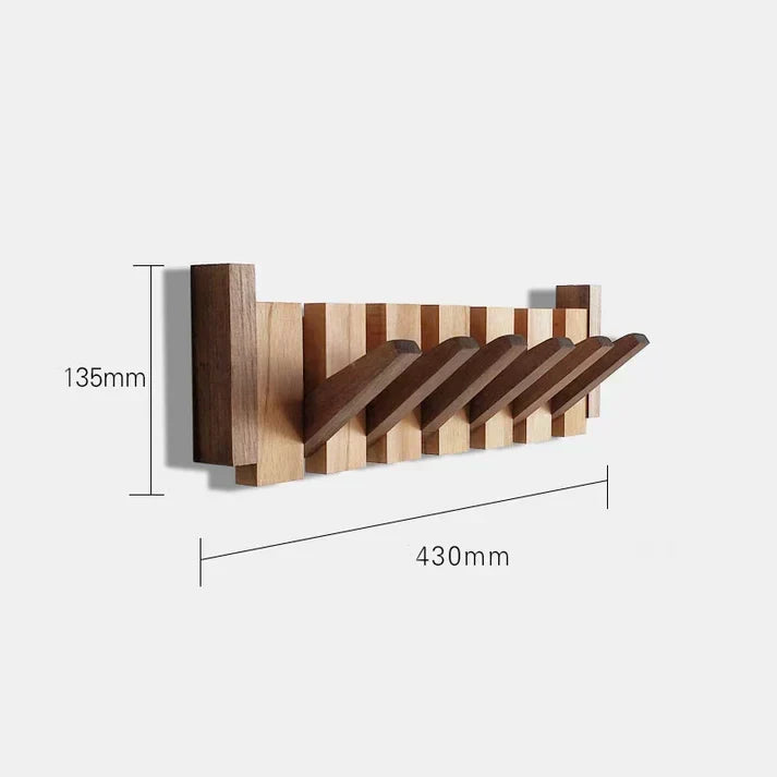 Minimalist wooden decor piece functioning as a practical coat hanger