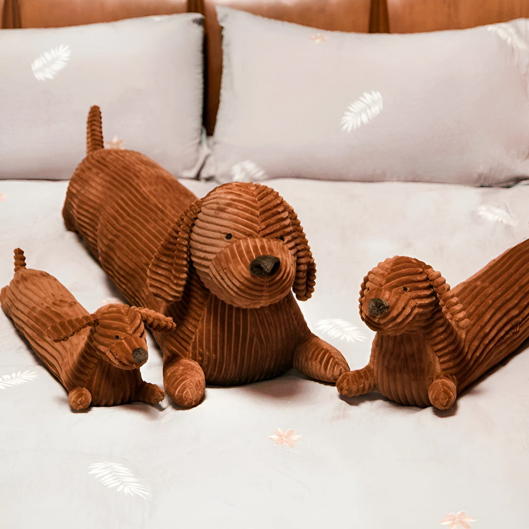 Cozy plush sausage dog pillow resting on a living room sofa