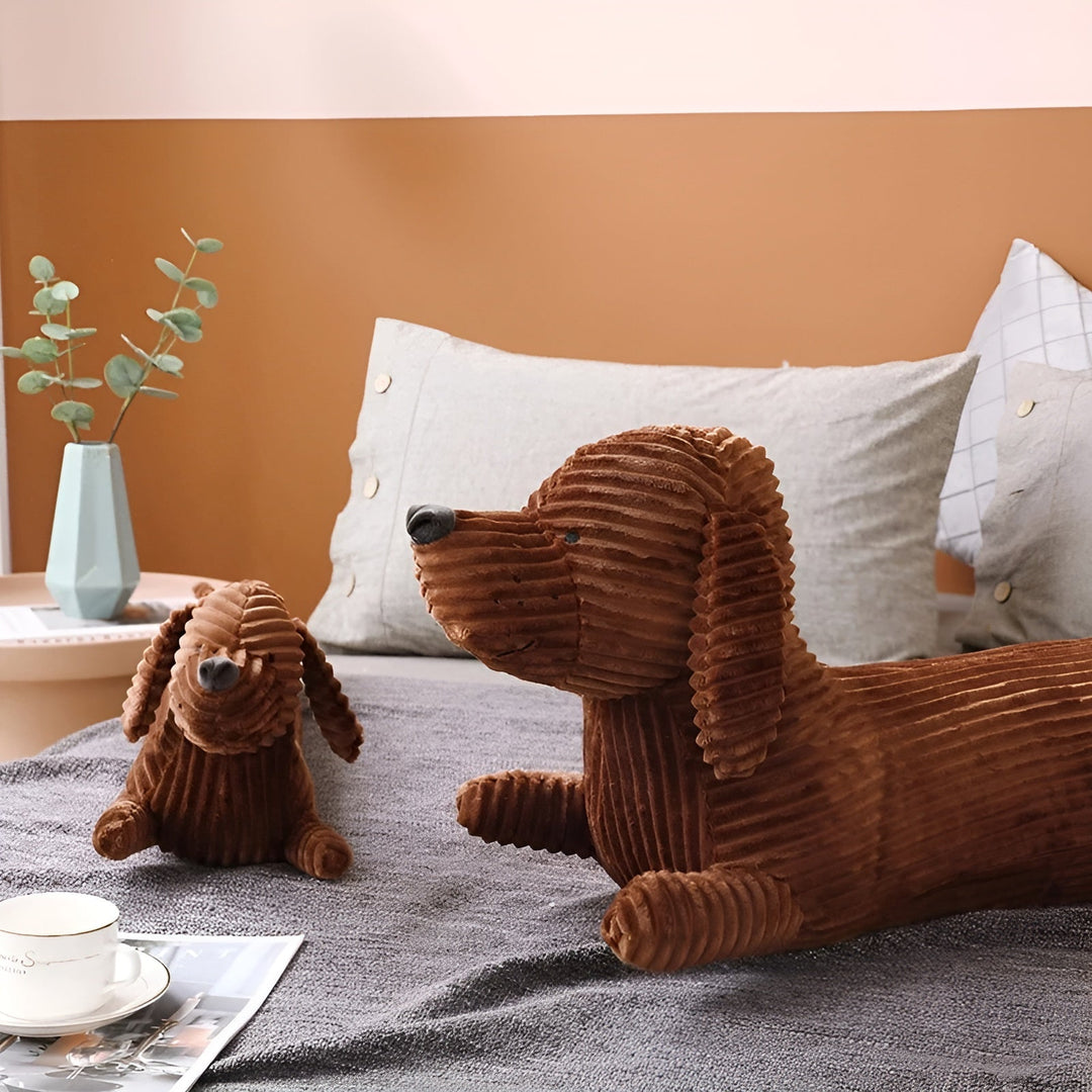 Person hugging the soft ergonomic dachshund plush toy for comfort