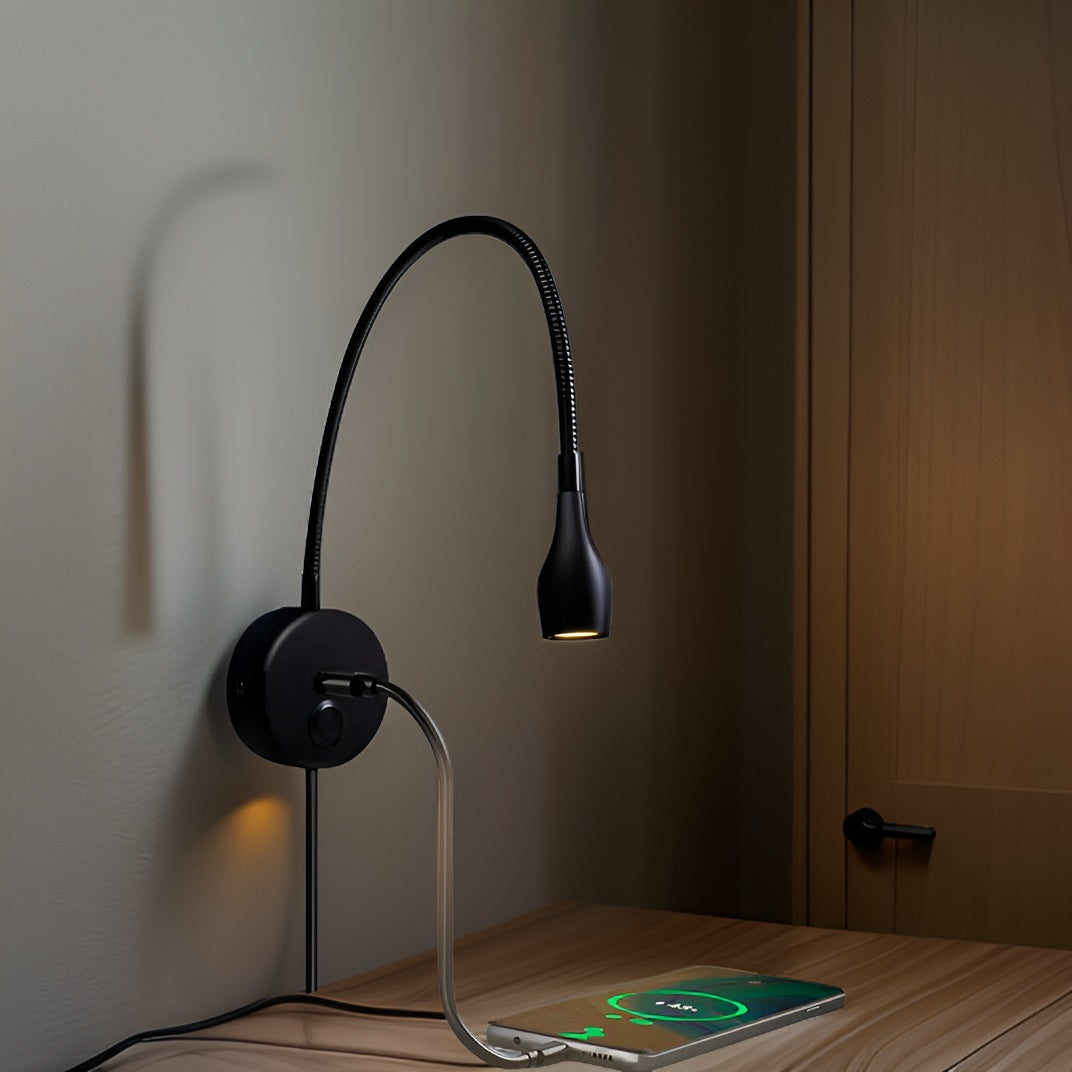 Adjustable gooseneck reading light mounted on wall as bedside sconce