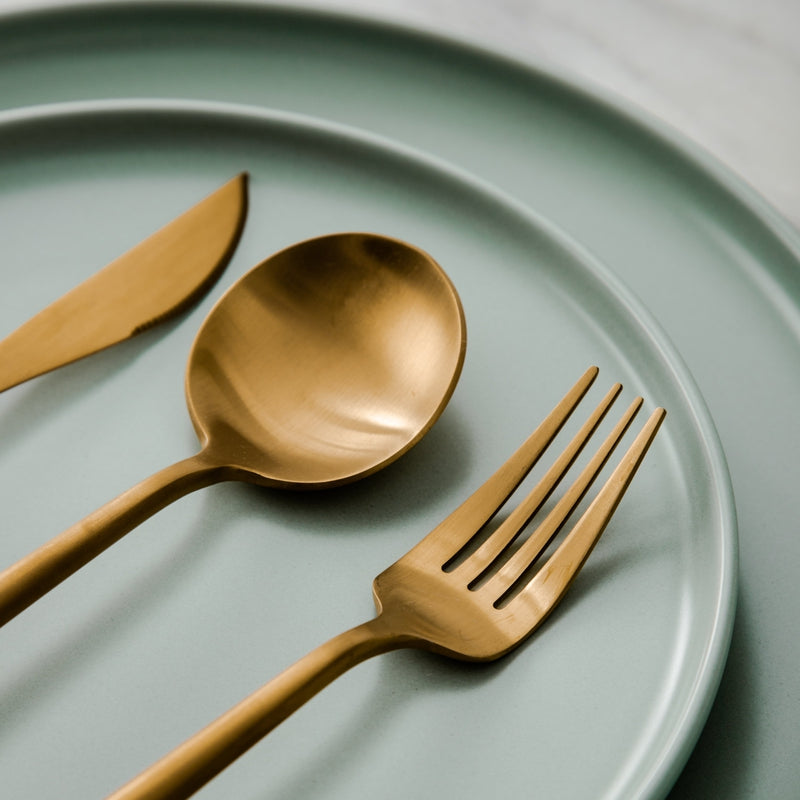 Close-up of a polished stainless steel dinner fork with sleek minimalist handle