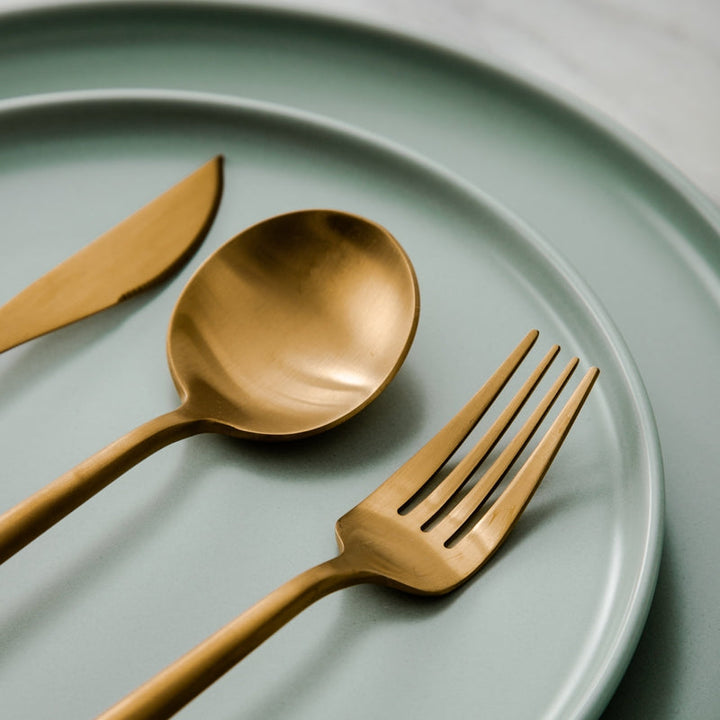 Close-up of a polished stainless steel dinner fork with sleek minimalist handle