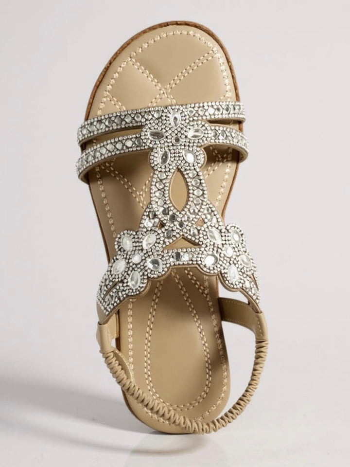Close up of embellished strap design on womens flat summer sandals