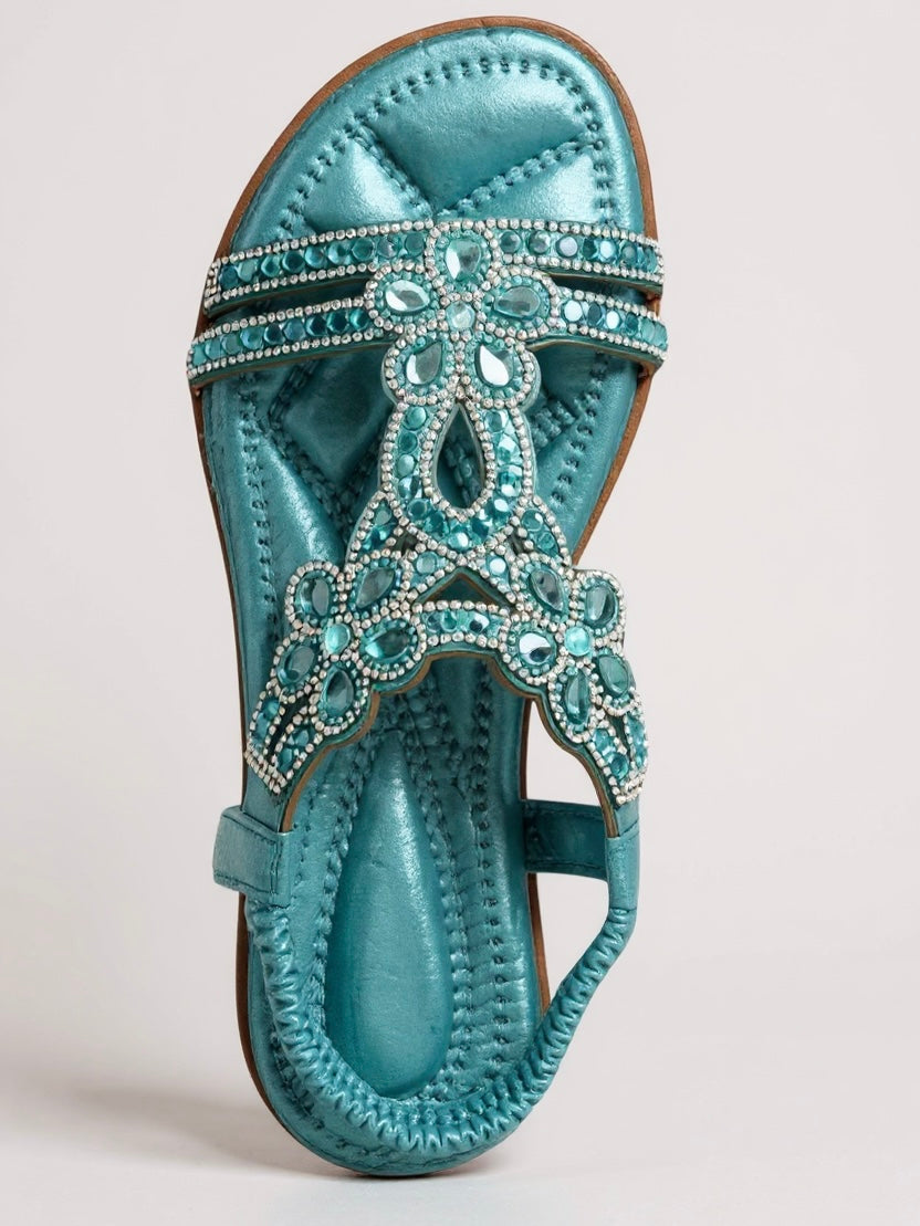 Pair of sparkling embellished flat sandals styled for summer wear