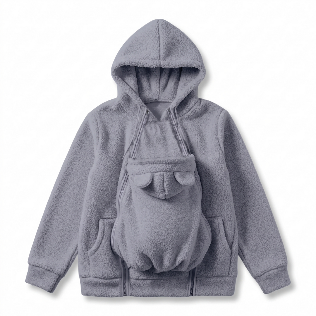 Cozy fleece maternity outerwear featuring babywearing pouch for mothers