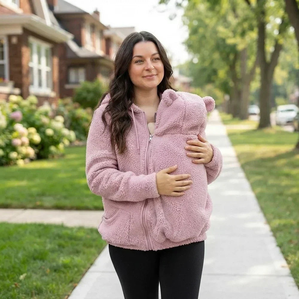 Womens fleece sweatshirt with babywearing feature laid flat for display