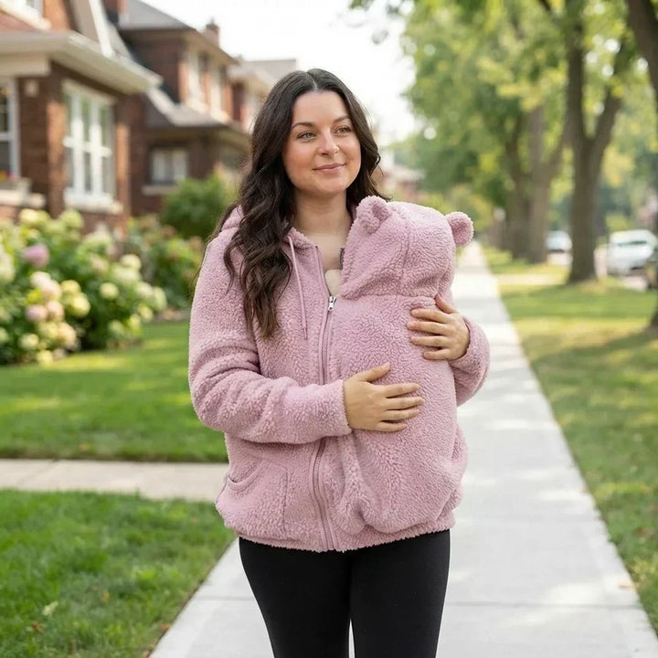 Womens fleece sweatshirt with babywearing feature laid flat for display