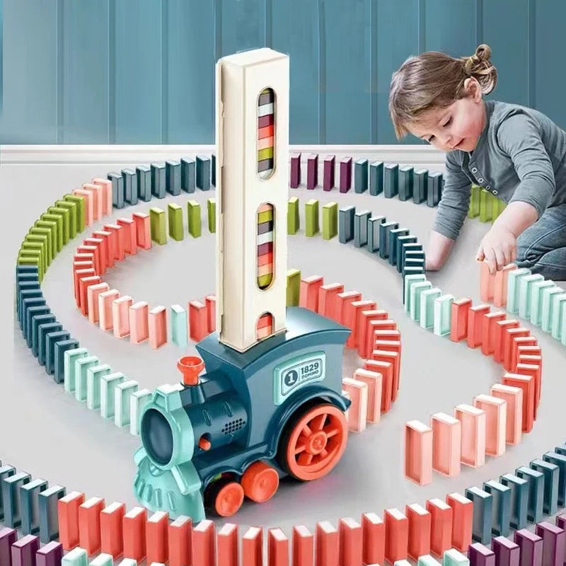 Child playing with colorful Domino Train building set