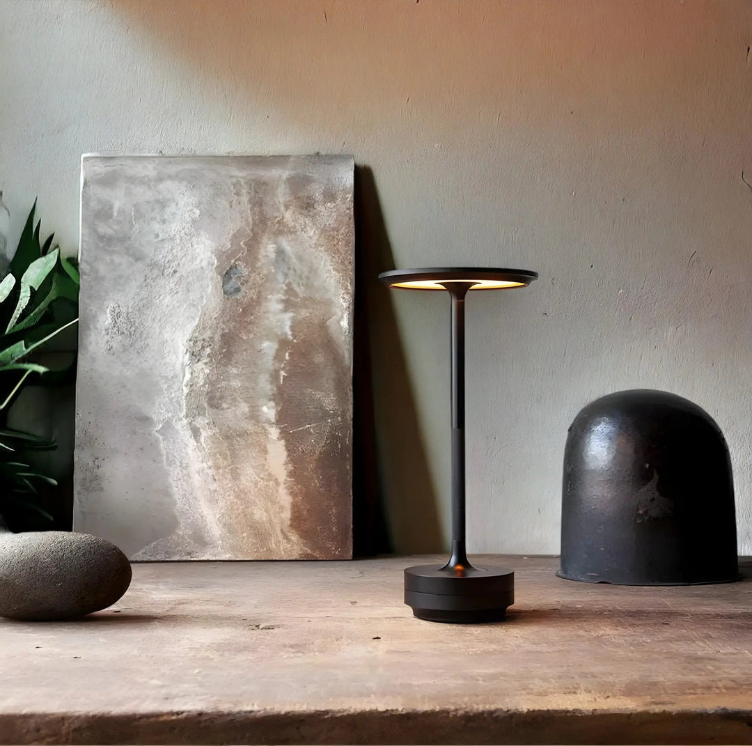 Cordless touch table lamp glowing softly on a modern nightstand