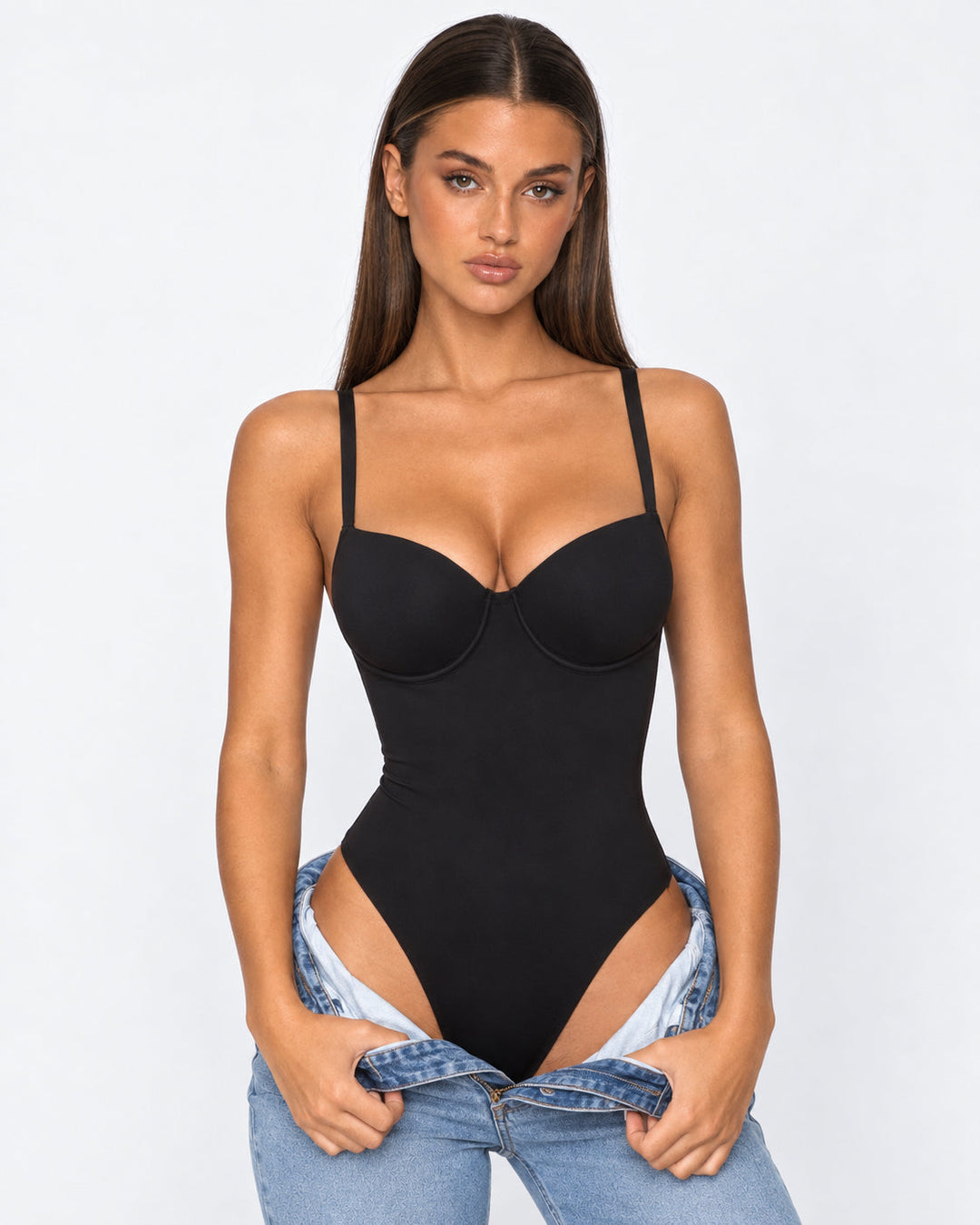 Front view of woman wearing black hourglass corset bodysuit with molded cups