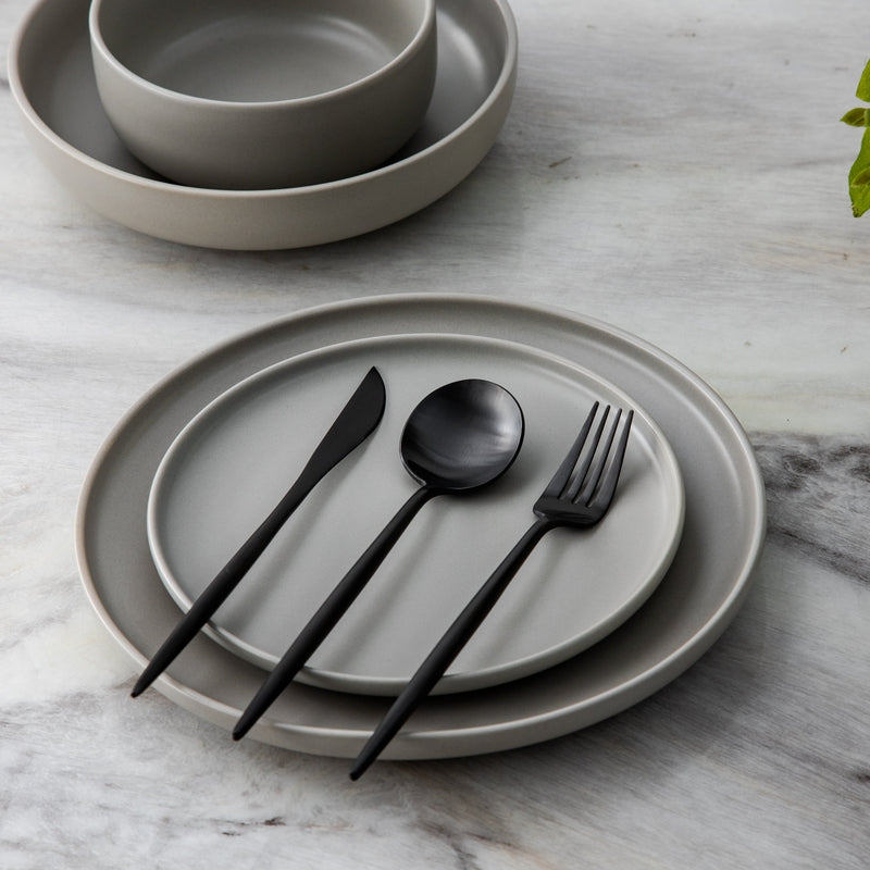 Minimalist tableware essentials including fork, knife, and spoon trio