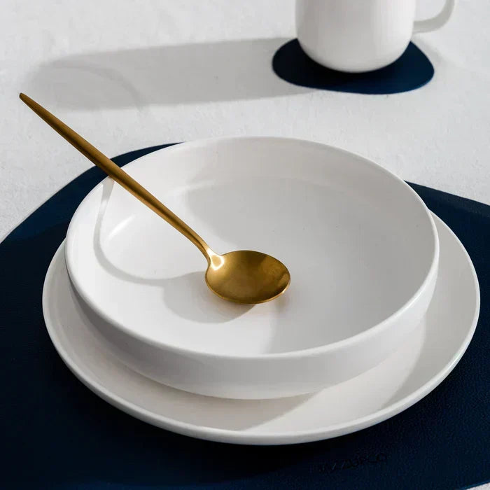 Side profile of a minimalist flatware piece highlighting its slim profile