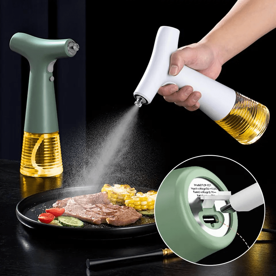 Electric oil sprayer in green and white dispensing mist over steak