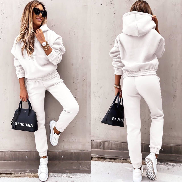 Woman wearing white tracksuit set front and back view