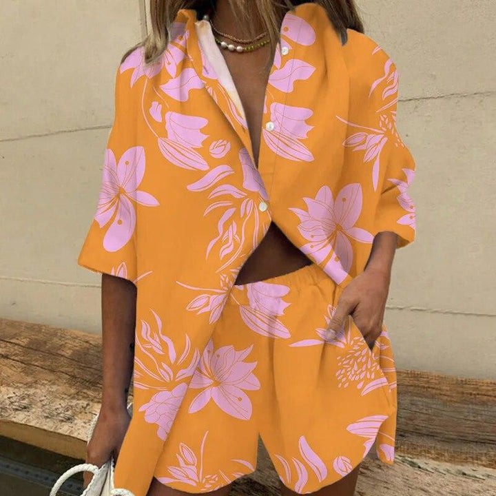 Woman wearing orange botanical print short set