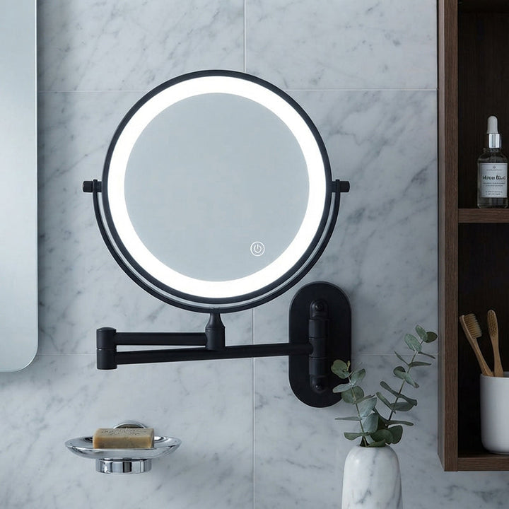 Wall-mounted LED magnifying mirror installed beside a modern bathroom sink
