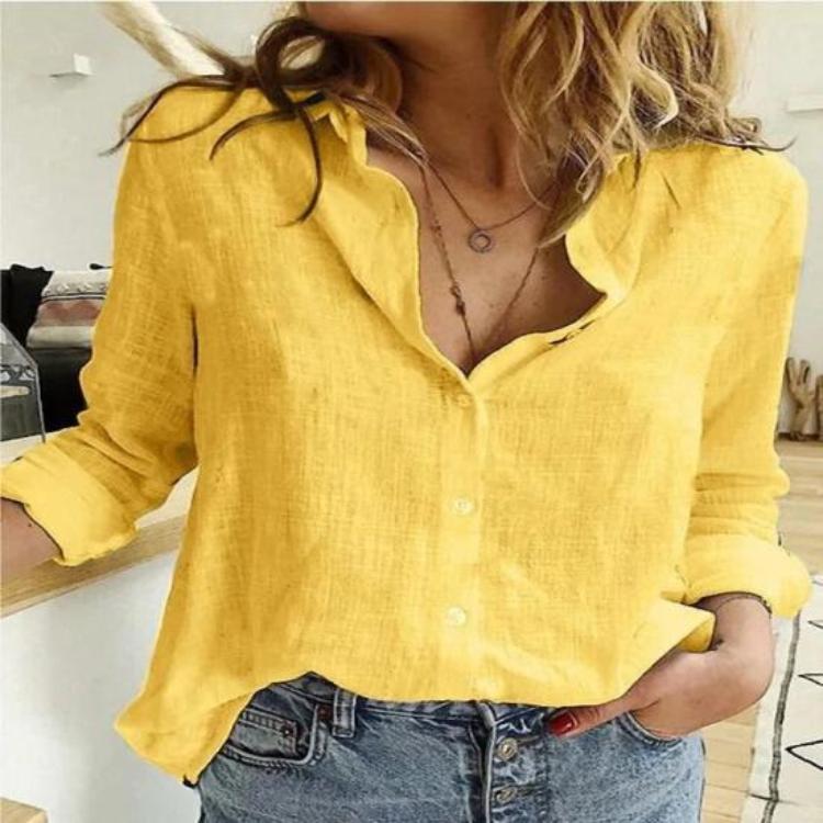 Woman wearing vibrant yellow long-sleeve button-down blouse