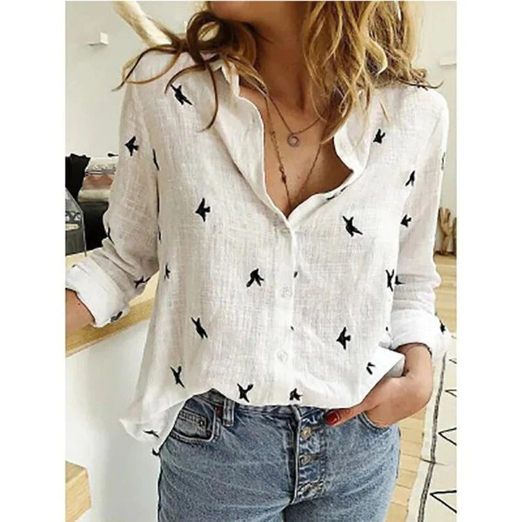 Woman wearing white bird-print long-sleeve blouse