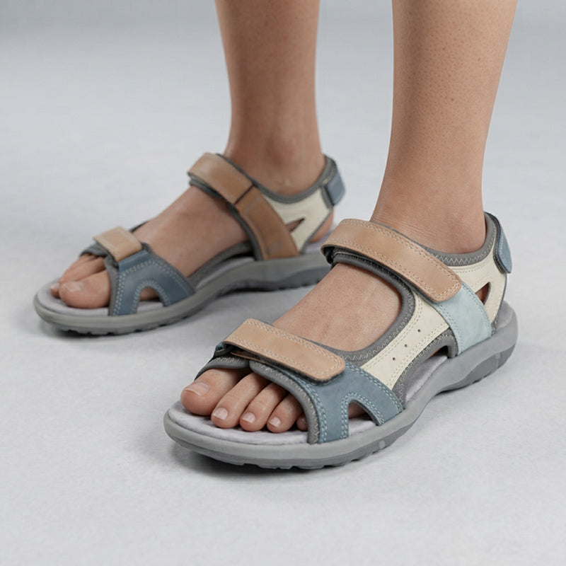Close-up of women's hiking sandals in grey and beige showing adjustable straps