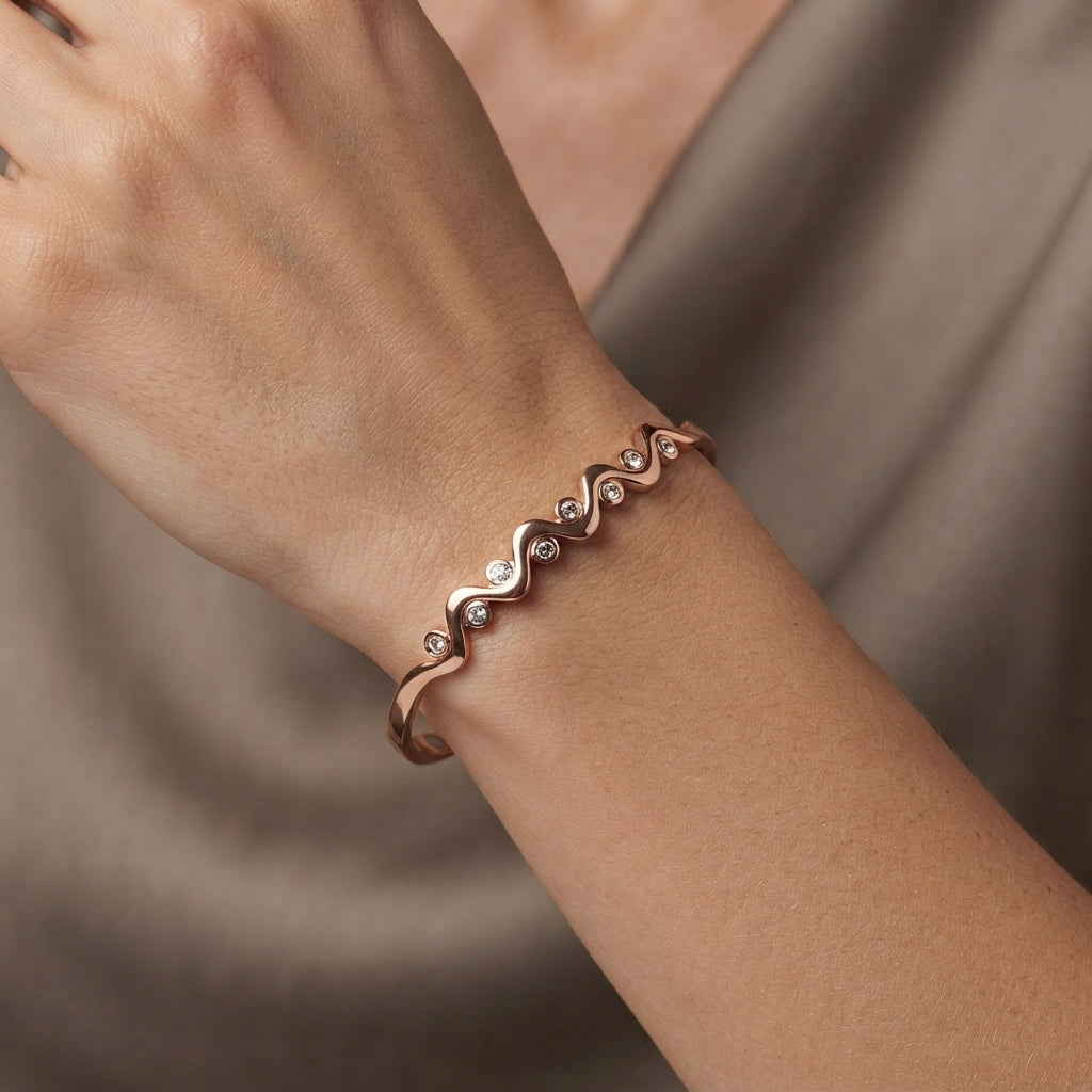 Women's elegant wave copper bracelet shown on a clean white background