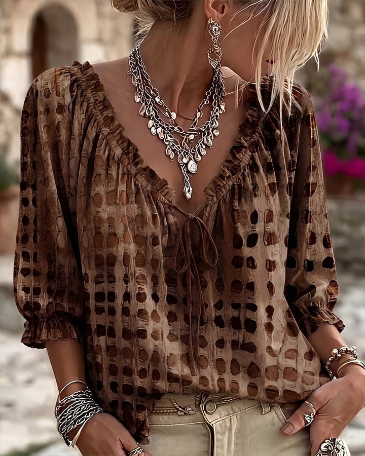 Flat lay of the casual polka dot blouse paired with accessories