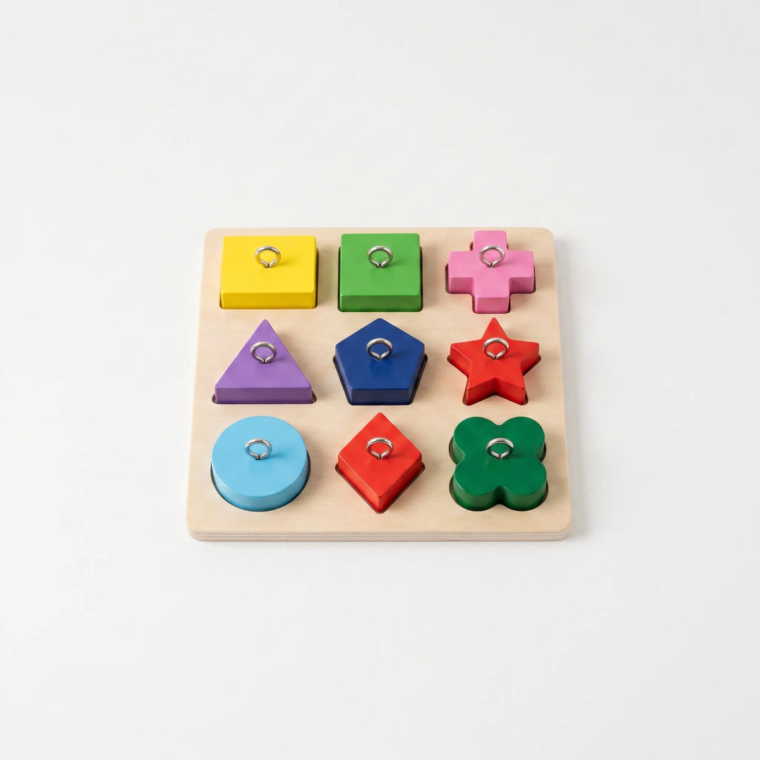 Colorful wooden puzzle board toy for birds with various geometric shapes and metal eyelets
