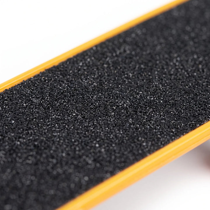 Close-up of the textured abrasive surface on the bird skateboard toy