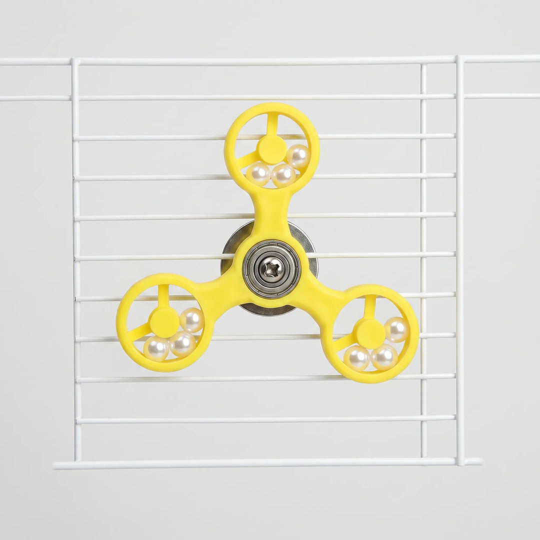 Yellow interactive bird toy mounted on white cage bars