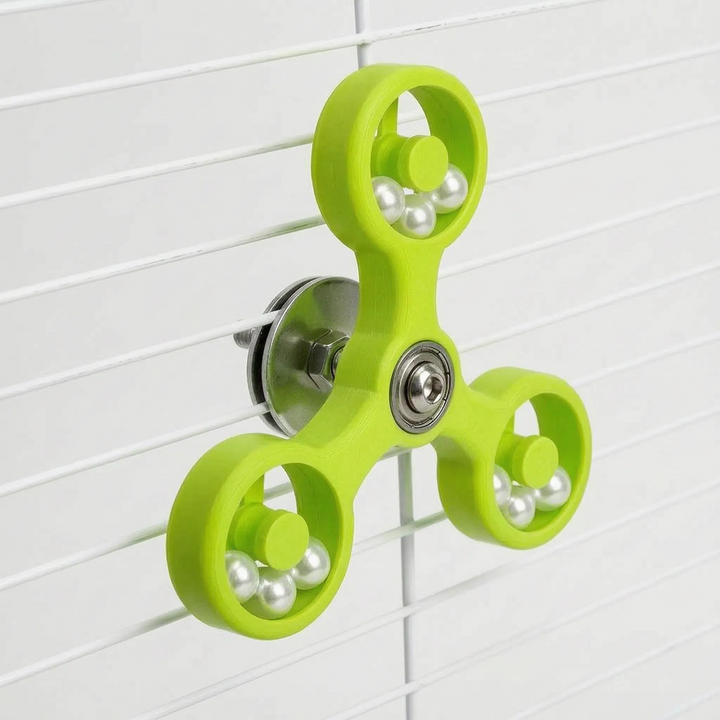 Budgie playing with interactive spinning cage accessory pet supply