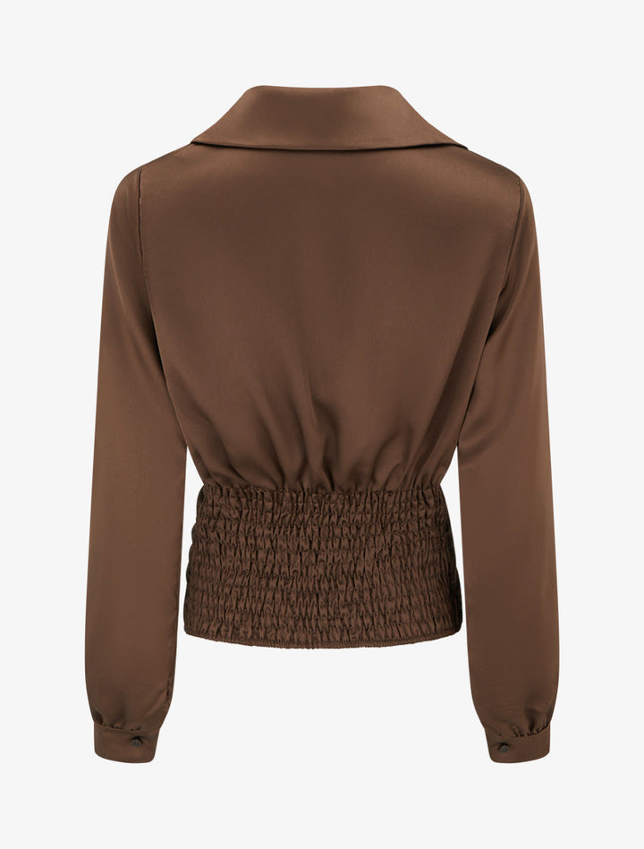 Back view showing elasticated smocked waistband of the satin top